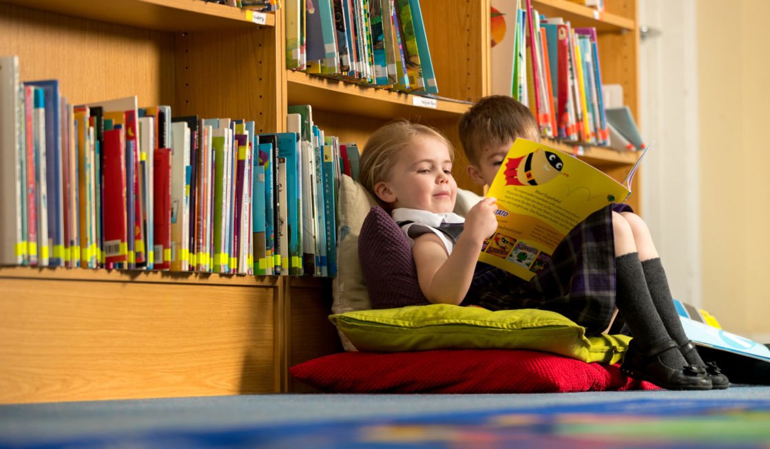 wycliffe nursery chikdren reading in the library